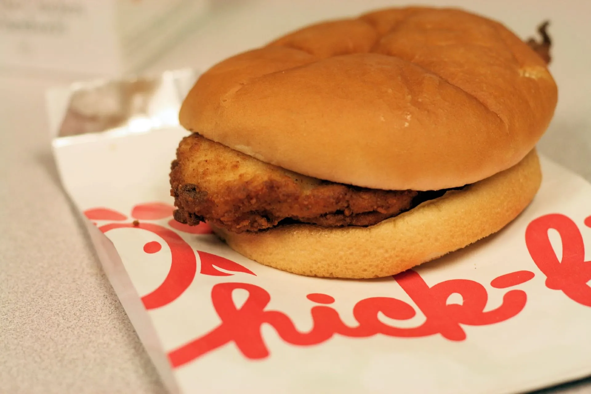 A Chick-fil-A Chicken Sandwich on its wrapper