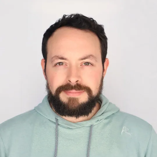 Sam Solomon wearing a green hoodie