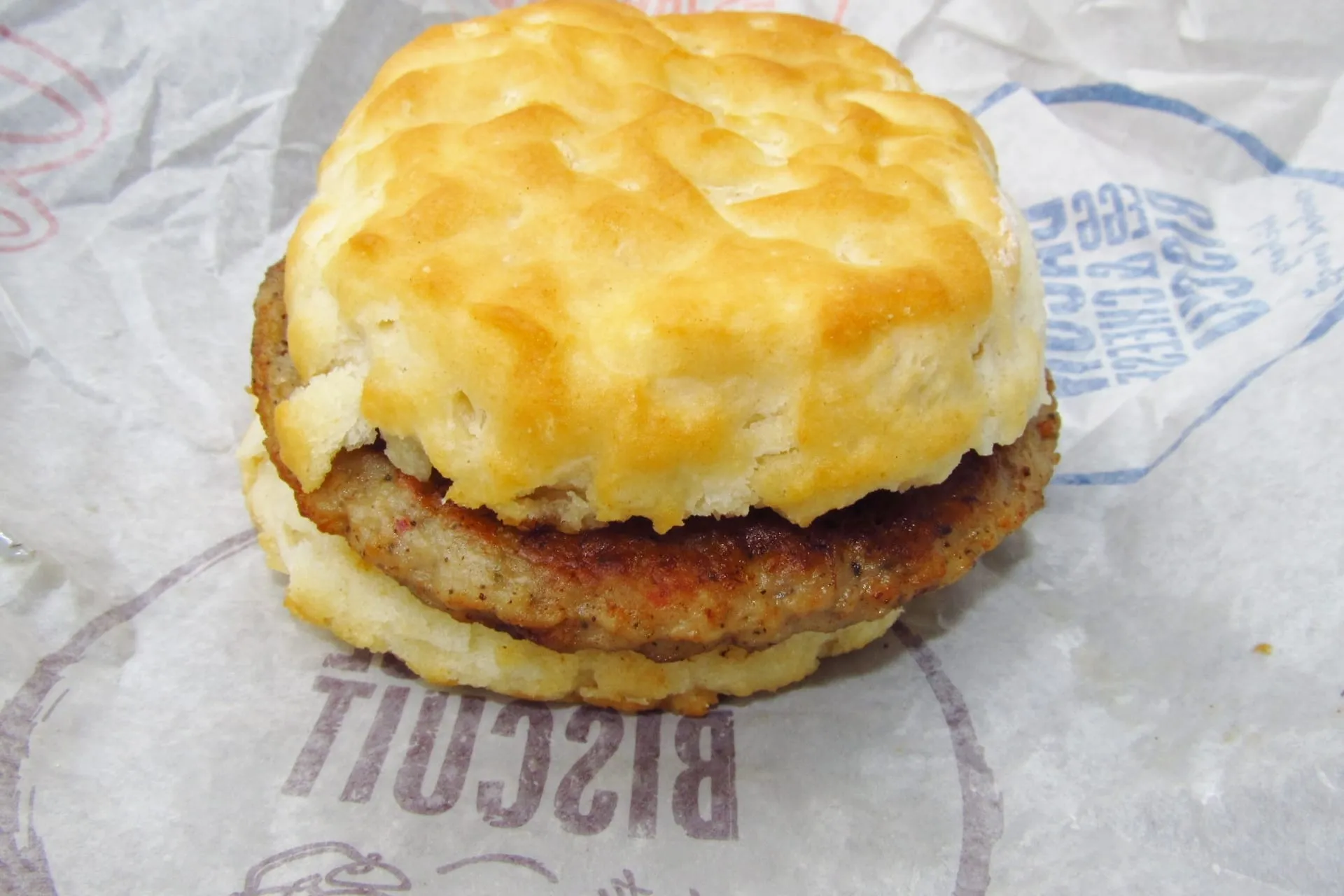 A Sausage Biscuit on its paper wrapper