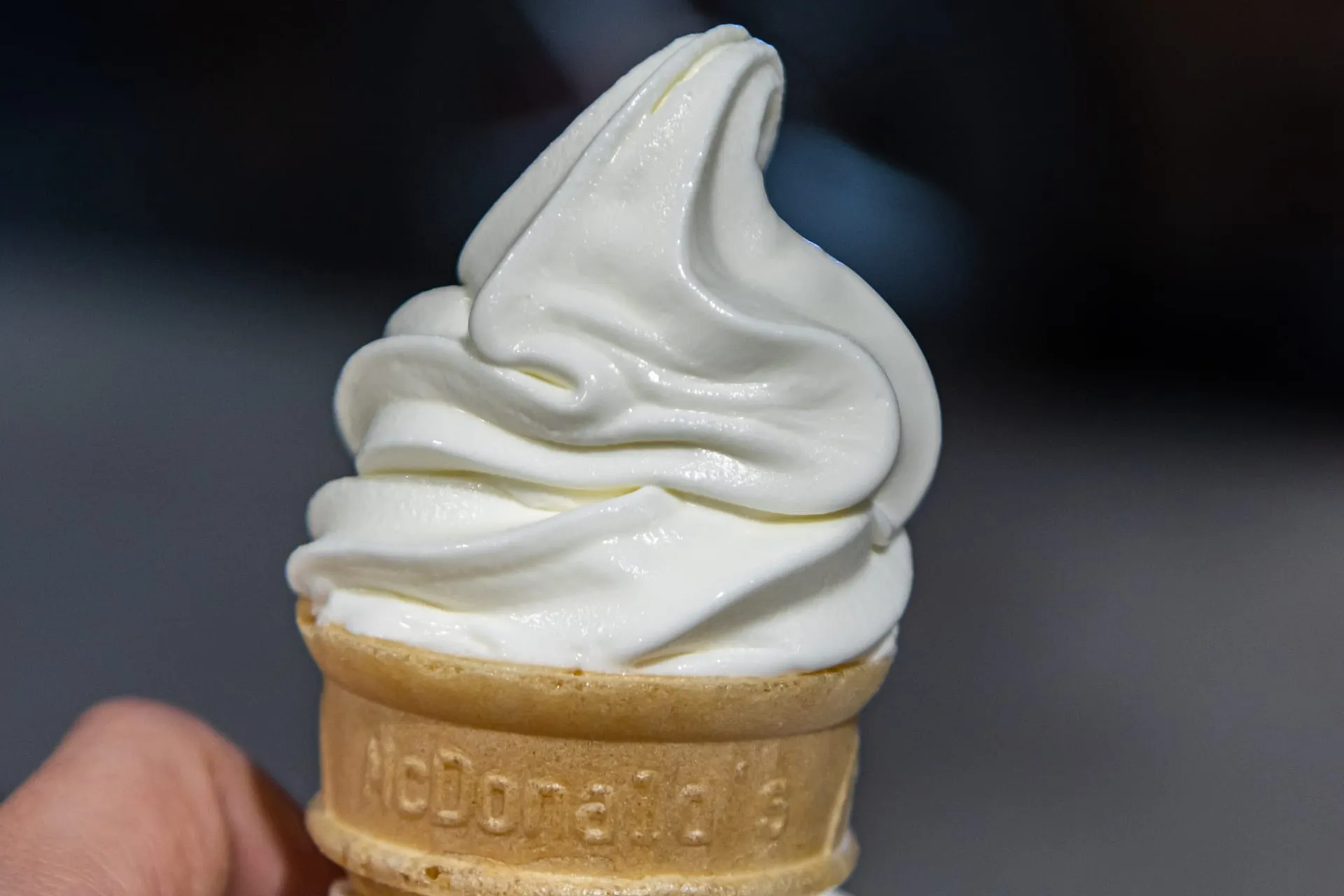 A Vanilla Cone held in a hand
