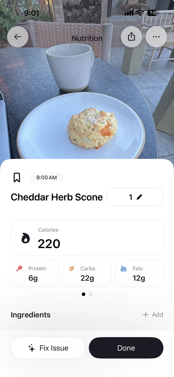 Cal AI's result for the photo. It names a Cheddar Herb Scone at 220 calories, with 6 grams of protein, 22 of carbs and 12 of fat, an Ingredients section with an Add button, and Fix Issue and Done buttons.